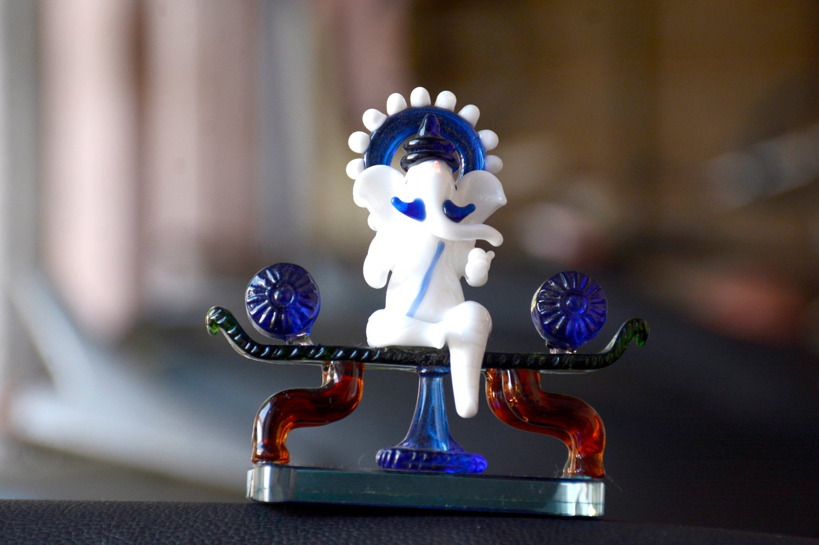 White Ganesha with Blue Accents and Ornate Base