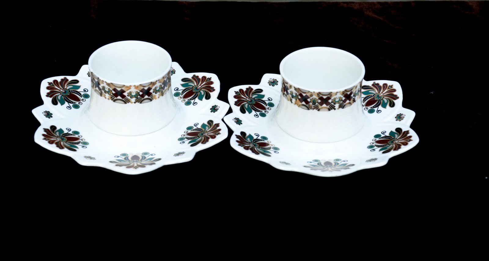 Ornate Tea Cups with Floral Patterns